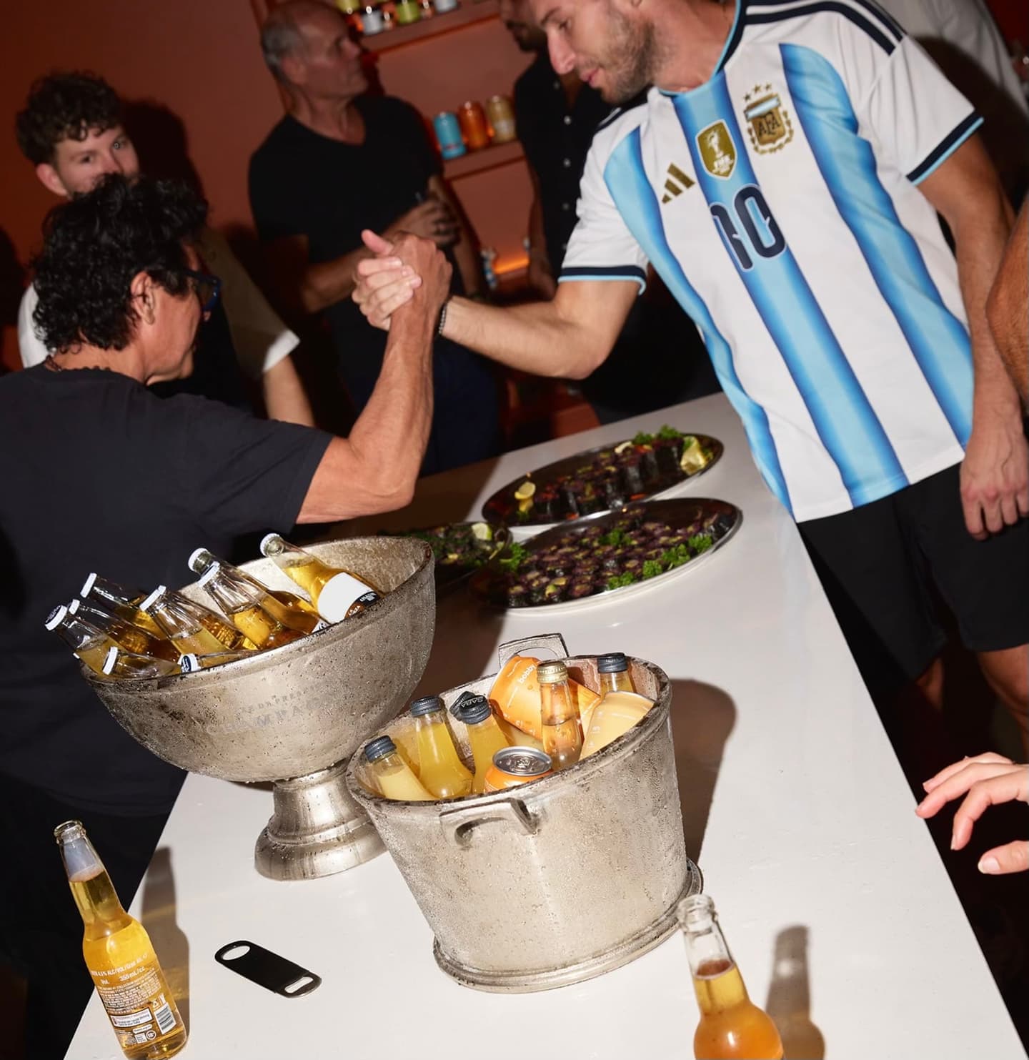 Friends gathering at Recess over food and drinks