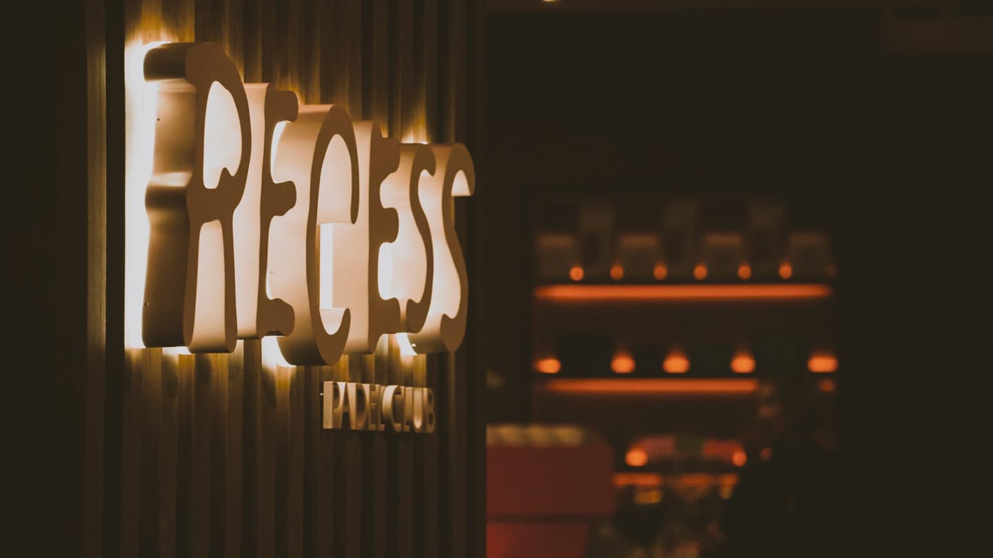 The Recess sign above the bar